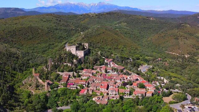 Aerial view of the village of Castelnou at the base of the Pyrenees Mountains in French Catalonia