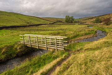 Footbridge across long Preston beck heading to Settle