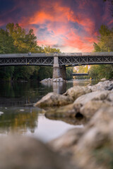 Fototapeta na wymiar bridge over the river at sunset