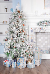 Christmas tree decorated with big presents white vertical