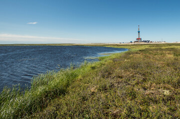 Fototapeta na wymiar drilling rig in the tundra in summer