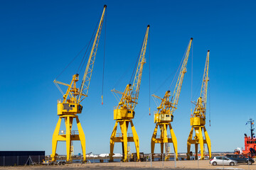 Fototapeta na wymiar View of yellow port cranes
