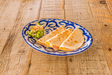 Synchronized, it is frequently confused with Mexican quesadillas. dThey are so called because the...