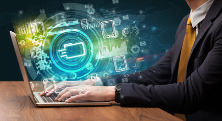 Business hand typing on a modern laptop