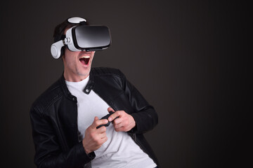 Man playing with vr glasses black isolated background