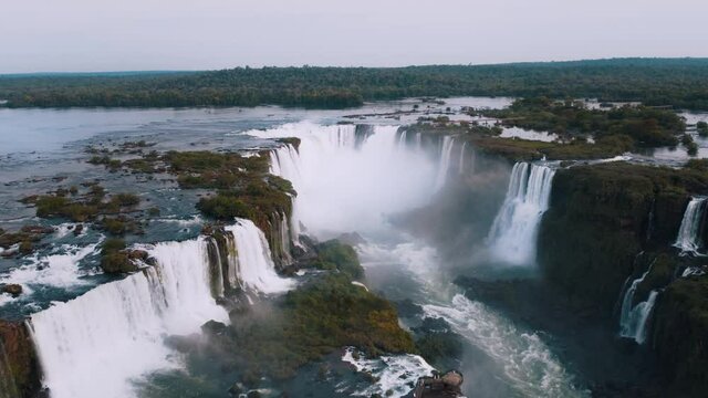 Beautiful aerial view of the Iguaçu Falls from a helicopter, one of the Seven Natural Wonders of the World. Foz do Iguaçu, Paraná, Brazil. 4K.