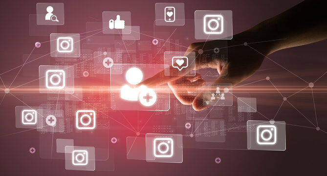 Hand pressing social media multimedia application screen with media icons on futuristic concept - Powered by Adobe
