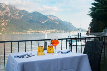 Two Aperol spritz cocktails at dinner restaurant in Lake Como Italy