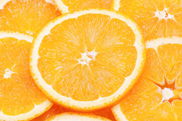 Navel orange slices background, top view, flat lay,