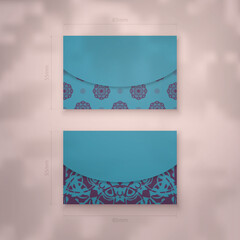 A turquoise business card with Greek purple ornaments for your personality.