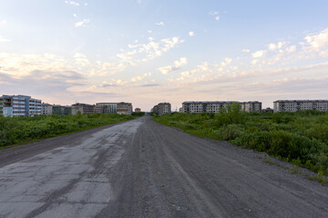 A deserted road to the abandoned ghost town of Komsomolsky. Evening