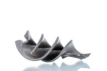 Uncooked black fusilli pasta, close-up, isolated on white.