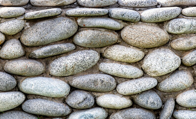 Rough stone wall as creative background texture
