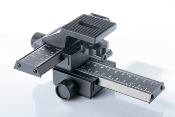 Aluminum 4-way macro photography focus slider isolated on white
