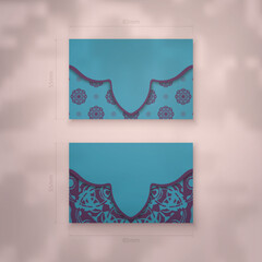 Business card in turquoise color with a mandala in purple pattern for your contacts.