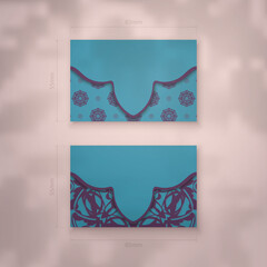 Business card in turquoise color with greek purple pattern for your contacts.