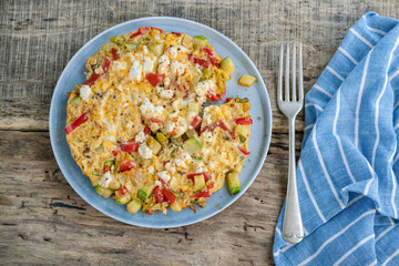 Homemade mixed veggie and cheese omelet on the table for breakfast