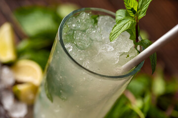 Luxury cocktail and cocktail shaker on black stone background