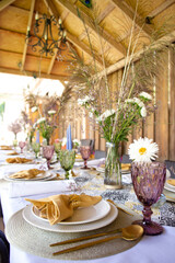 serving the festive table with decorative plates and forks and spoons
