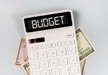 Word budget on calculatir and money. Finance concept.