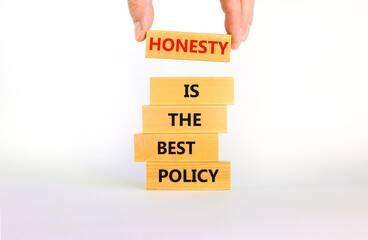 Honesty is the best policy symbol. Wooden blocks with words Honesty is the best policy on beautiful white background, copy space. Businessman hand. Business, honesty best policy concept.
