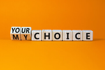 My or your choice symbol. Turned cubes and changed words 'my choice' to 'your choice'. Beautiful orange background, copy space. Business and my or your choice concept.