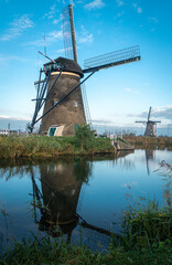 Fototapeta premium Ancient windmills on the edge of the canal at Kinderdijk, Netherlands