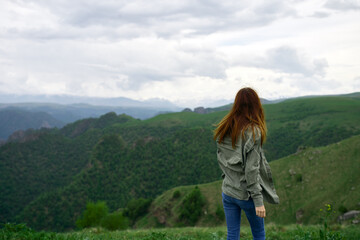 Fototapeta na wymiar woman outdoors in the mountains travel landscape fresh air