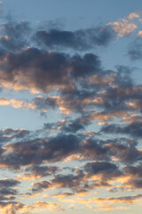 The evening sunset.  Cirrus cloudscape on blue sky.Tragic gloomy sky.