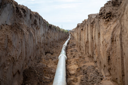center-pivot irrigation tubing being laid in a sandy soil in Wisconsin