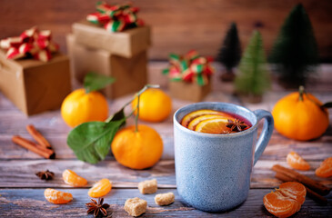 Mulled wine with oranges and anise in a cup