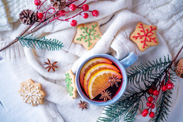 Mulled wine with oranges and anise in a cup