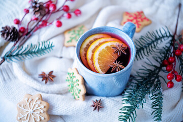 Mulled wine with oranges and anise in a cup