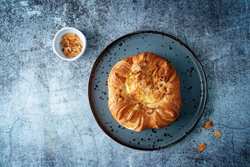 Vanilla cream almonds sweet bun in a plate