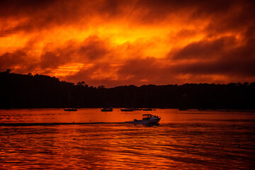 Blood orange sunset over harbor in southern Maine