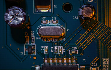 A close-up macro shot of a quartz resonator for controlling a computer (CPU), a quartz clock on an...