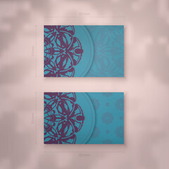 Business card template in turquoise color with vintage purple ornaments for your personality.