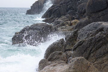 waves crashing on rocks