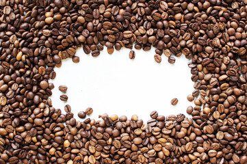 background from coffee beans on a white table. Coffee time. kind of sveru. flat lay. space for inspirational text.
