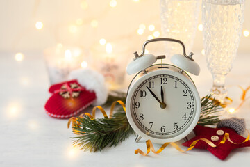 New Year's Eve. Almost midnight. Festive home decor, bright christmas lights on background. Cozy holiday atmopshere