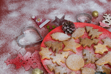 Christmas still life close up. Gingerbread cookies on a red background.