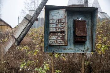 Rusted mailboxes in an old abandoned Russian village