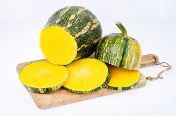 Ripe raw butternut squash, sliced. Studio Photo.