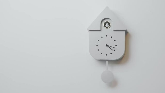 Beautiful view of grey wall cuckoo clock on colorful background. Sweden.