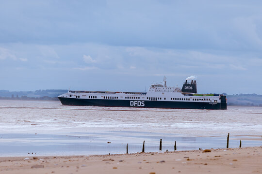 Example of a DFDS ro-ro cargo container ship at sea near to the beach and coastline (HULL, UK - OCTOBER 23, 2021)