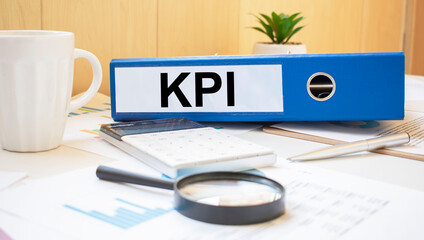 KPI words on labels with document binders