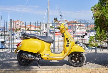 cute yellow motor scooter in retro style © pridannikov