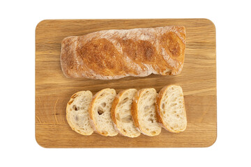 crusty baguette on wooden board isolated on white