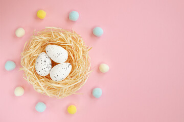 easter eggs in the nest, isolated on pink background