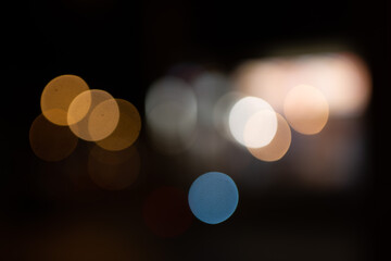 bokeh ronds de lumière chaude jaune bleue gris  sur fond noir